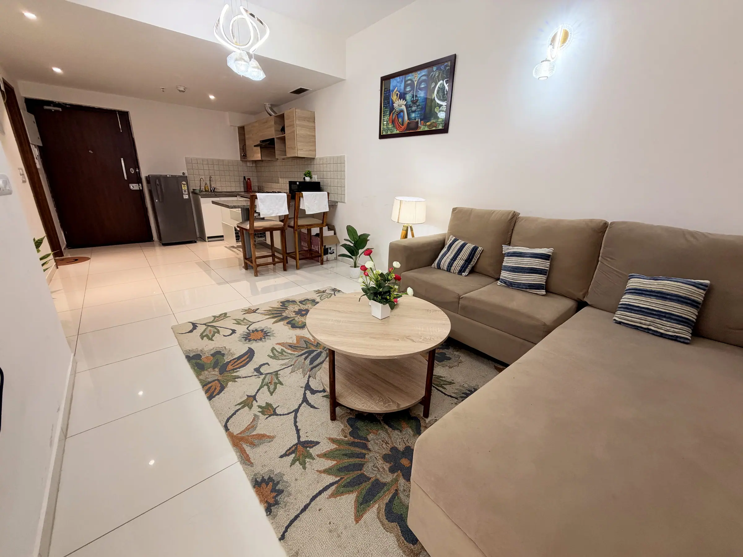Living room looking towards the breakfast bar, kitchen and front door