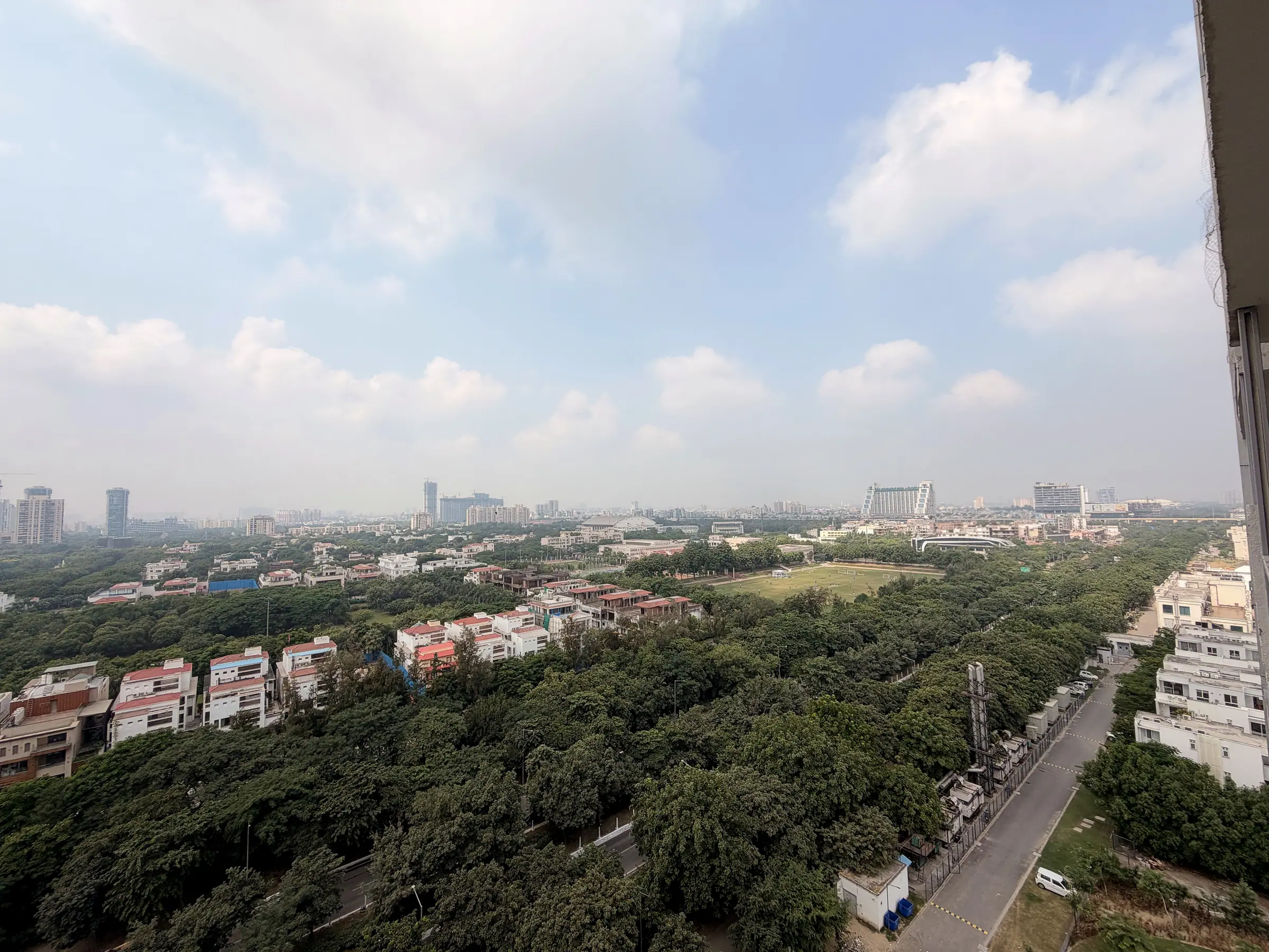 Tree-lined boulevard, villas and open greens below the suite